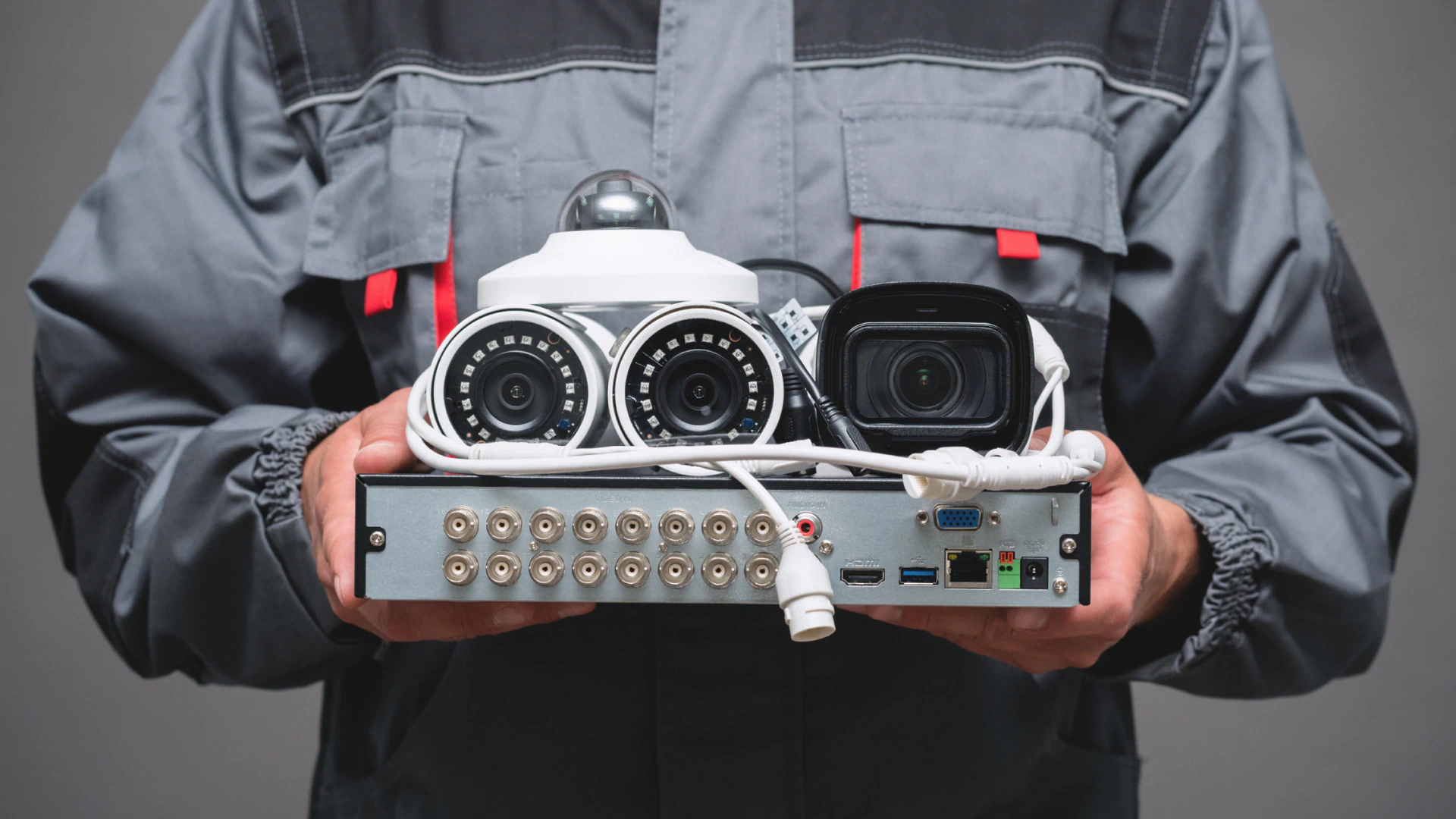 a person holding a seurveilance system